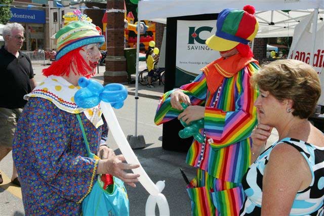 Clowns sculpting twisty balloons at Street Festival, Community Entertainment with Fun Events, Toronto